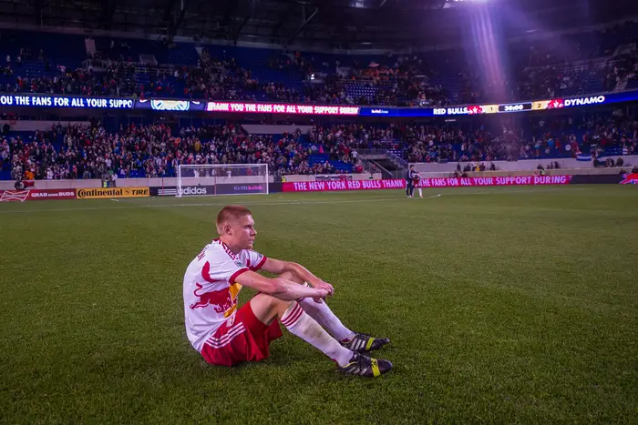 Markus Holgersson sits on the field after the final whistle.